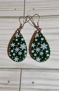 Snowflakes on green glitter