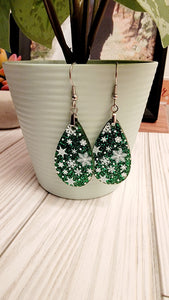 Snowflakes on green glitter
