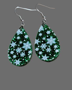 Snowflakes on green glitter